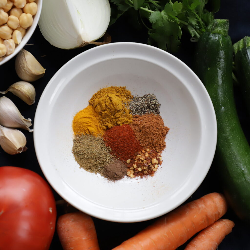 assortment of couscous spices in a white bowl